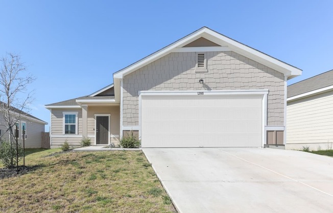 Front view of the Dogwood one-story single-family rental house at Beacon at Presidential Heights in Manor, TX