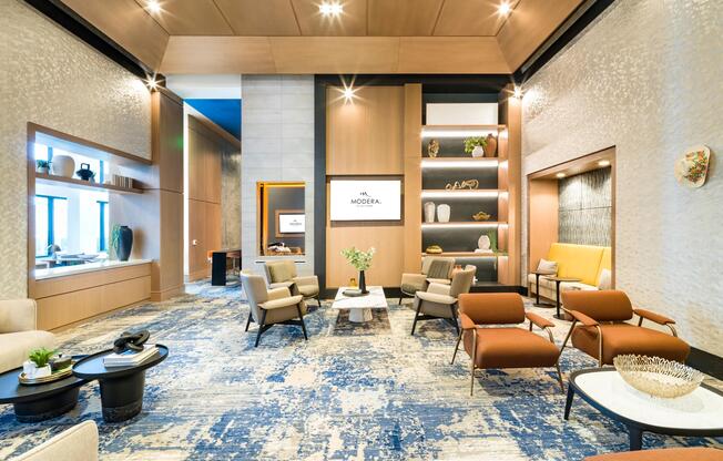 A spacious resident lounge at Modera McGavock, blending warm textures and curated seating just a short drive from Nashville’s music and dining scene.