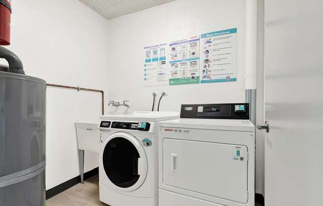 A white dryer and washer are in a laundry room.
