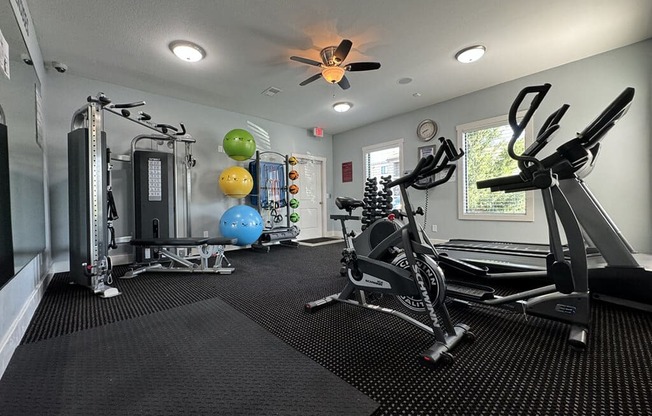 gym with a variety of equipment  at apartment community