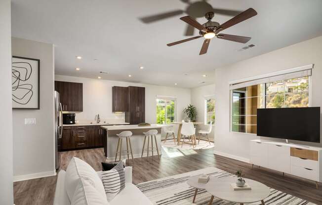 Living room with a ceiling fan and a kitchen in the background  at Lakeview 88, Spring Valley, CA