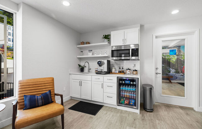 a kitchen with a refrigerator and a microwave