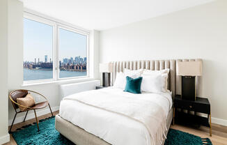 Bedroom photo with southern river views. Apartment 2107.