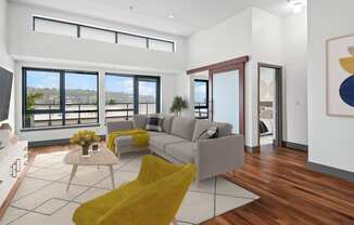 Living room with a gray couch and yellow chairs at Equinox, WA, 98102