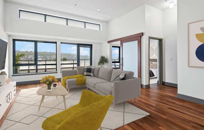 Living room with a gray couch and yellow chairs at Equinox, WA, 98102