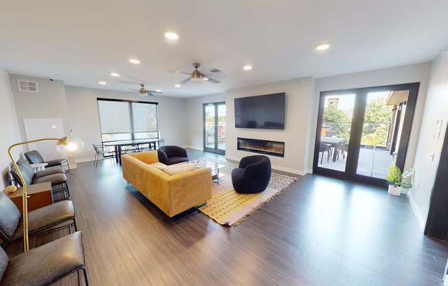 a living room with a couch and a television at Canary Lofts, Iowa, 50311