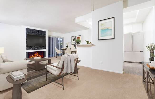 a living room with a couch and a table and a fireplace