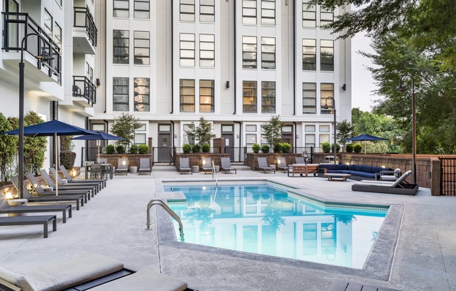 Resort-style swimming pool with sundeck.