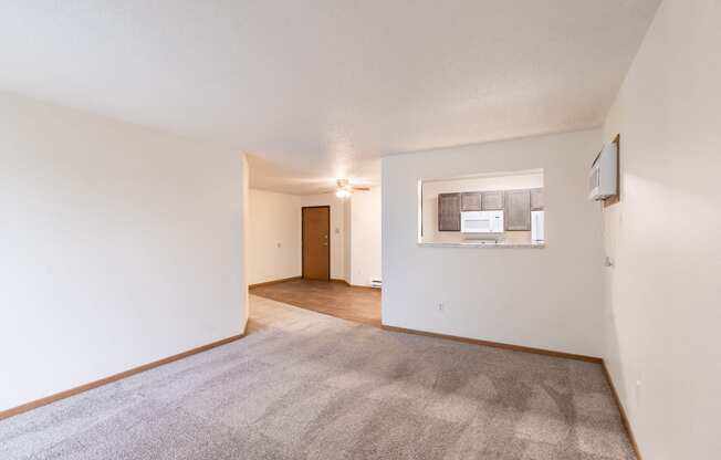 the living room and dining room of an apartment. Fargo, ND Oxford Apartments