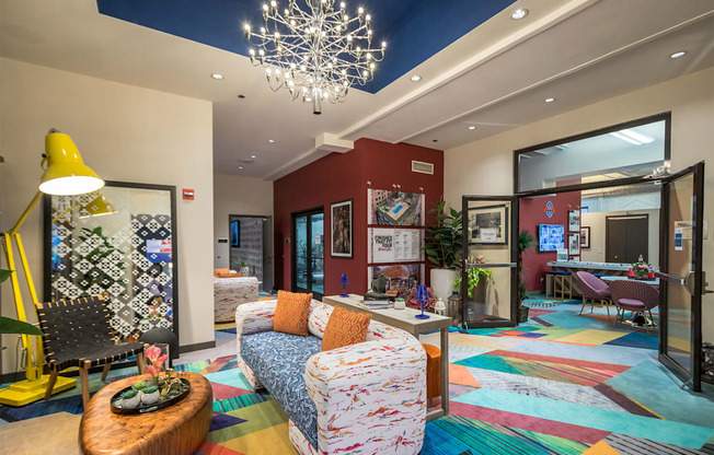 a living room with couches and chairs and a fireplace