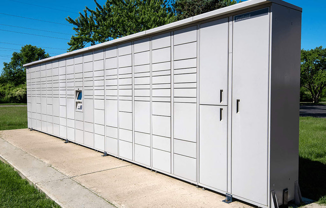 the side of a metal building with a garage door