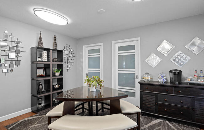 a dining room with a table and chairs