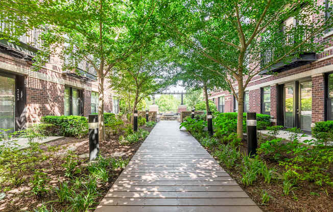 Image showing nature meets neighborhood. Pathways, pergolas, and peaceful moments tucked into the courtyard.