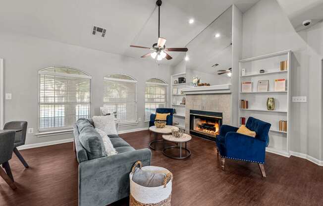 Austin, TX Apartments – Huntington Meadows– clubhouse with couches and chairs and a fireplace