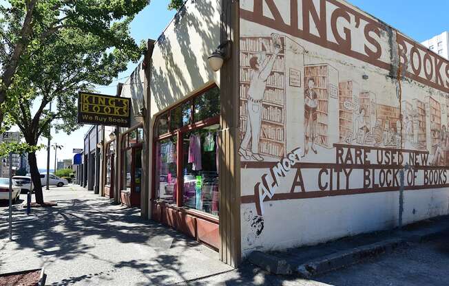 A book store named King's Books is located on a sidewalk.