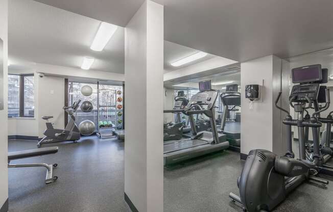 a gym with treadmills and other exercise equipment in a building