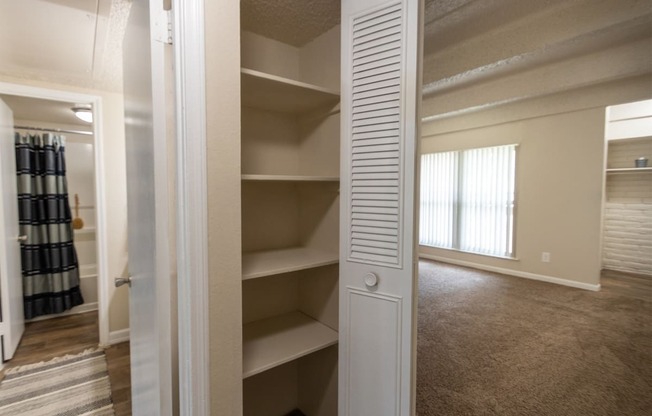 This is a photo of the hall linen closet in the 965 square foot 2 bedroom, 2 bath  apartment at Harvard Square Apartments, in Dallas, TX.
