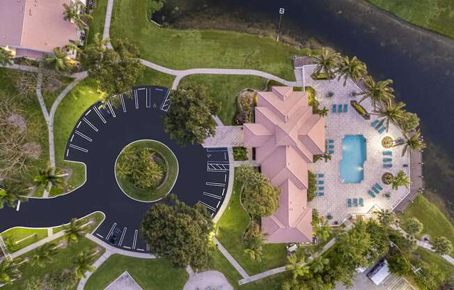 a house shaped like a clock with a pool and a yard