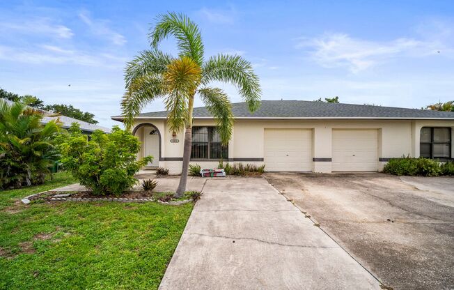 Stunning duplex offers two spacious bedrooms and two full bathrooms in Cape coral