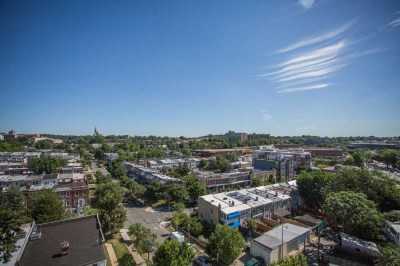 an aerial view of a city with trees and buildings