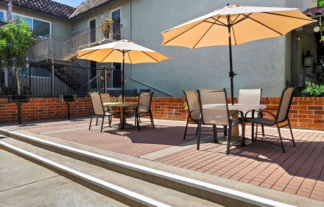 Pet-Friendly Apartments in Encino, CA- Brookside Terrace Apartments- Picnic Area with Circle Tables and Umbrellas