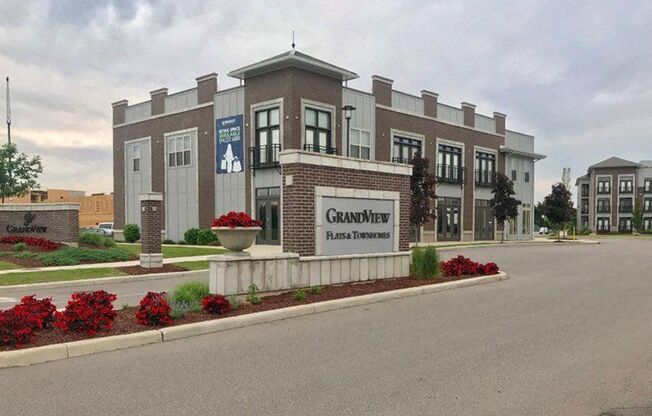 The Grandview Plaza has a sign that says "Plans to Tomorrow.".