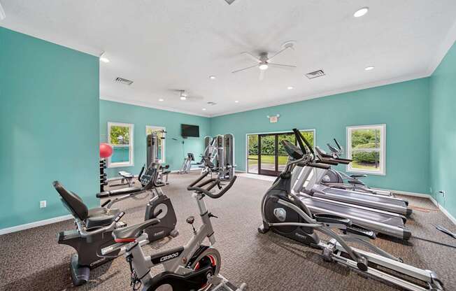 A spacious gym with a variety of exercise equipment.