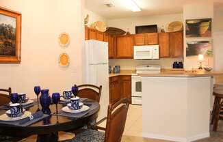 Fully Equipped Dining Area at Villa Valencia Apartments, in rlando Florida