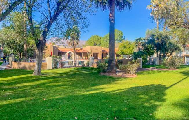 Community filled with lush landscaping and mature trees at La Hacienda Apartments in Tucson, AZ!
