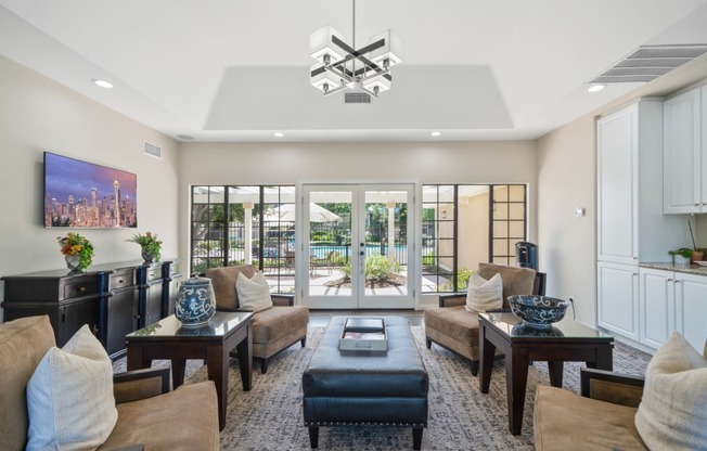 a living room filled with furniture and a large window