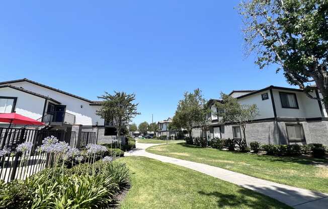 a neighborhood with houses and a sidewalk