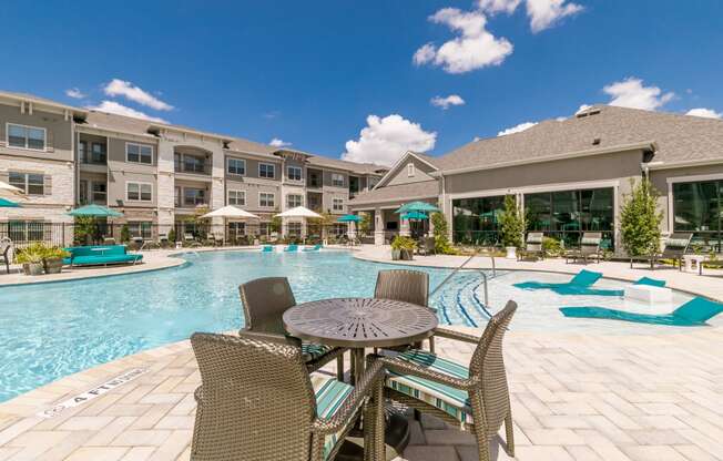 Poolside Dining Table at Cue Luxury Apartments, Cypress, TX, 77433