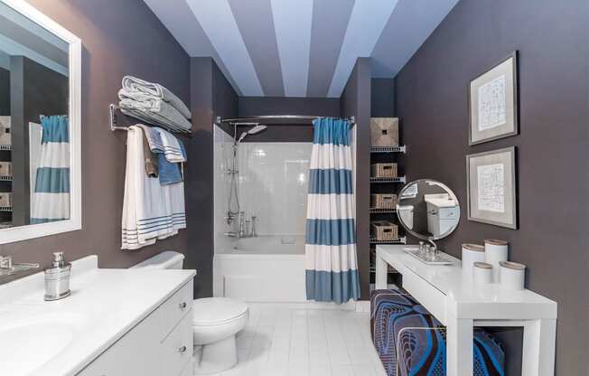 a bathroom with a shower and a sink and a toilet