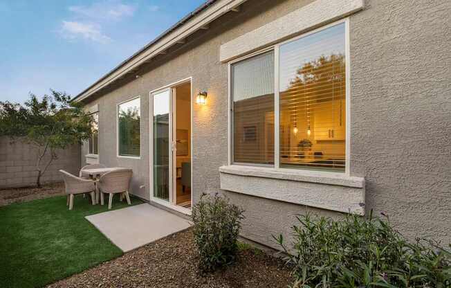 A house with a patio and a table.