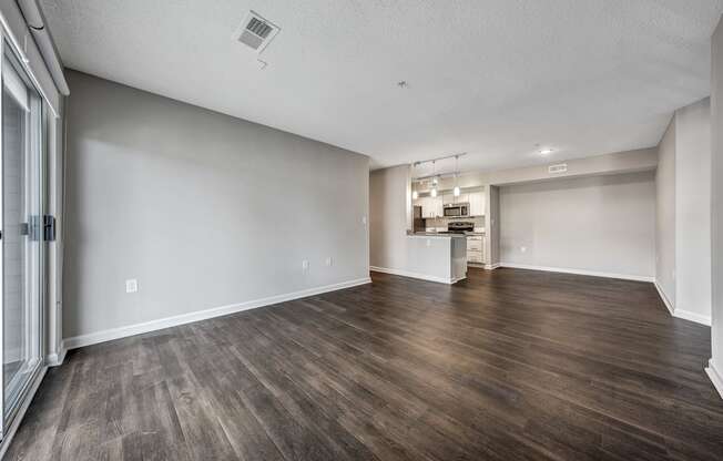 A room with wooden floors and white walls.