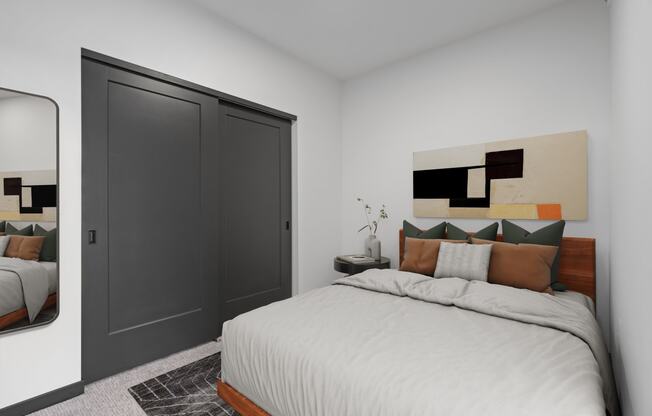 a bedroom with a large bed and a closet