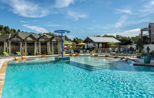 A large swimming pool with a blue tinted water.