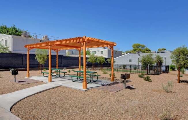 a picnic area in a park with picnic tables