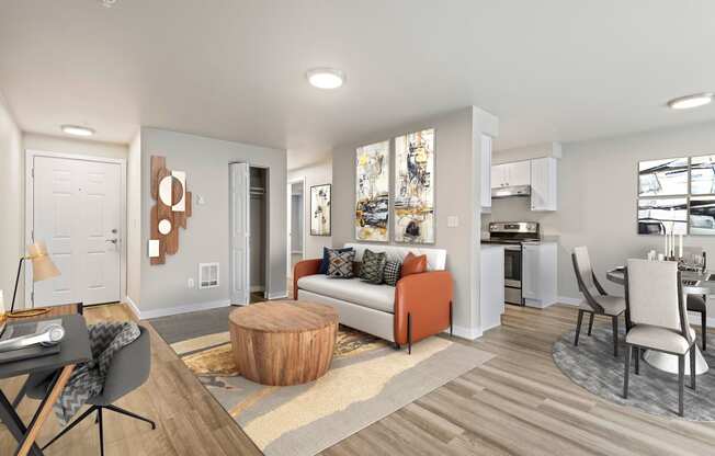 a living room with hardwood floors and view into dining room and kitchen at Foster Creek apartments in Tukwila