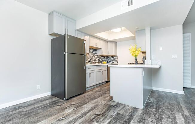 a kitchen area with a building in the background