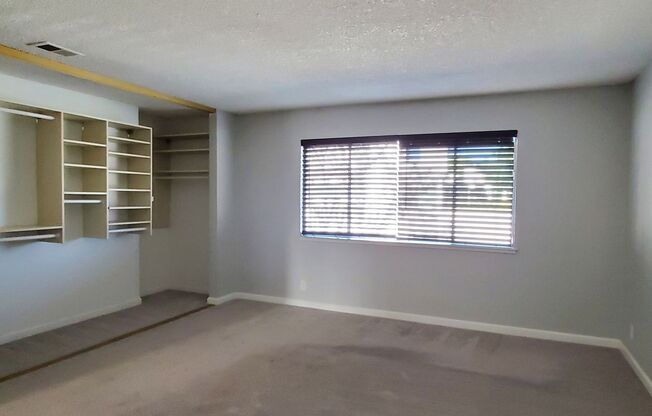 Upstairs Condo with 2 Car Garage, Fresh Paint, Wood Floors, Large Patio, Pool!
