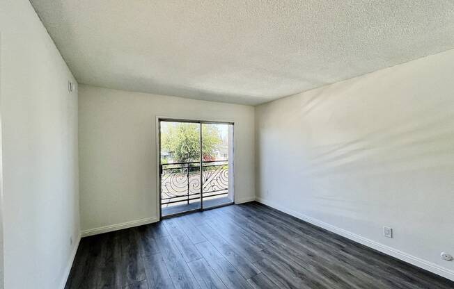 Bedroom with Hardwood Floors and Patio Doors