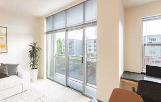 a living room with sliding glass doors to a balcony