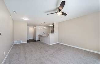 living room with a ceiling fan at Trade Winds Apartment Homes, Elkhorn, Nebraska