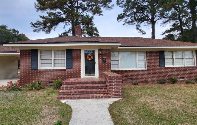 3 Bedroom 1 1/2 Bath Ranch style brick home with attached carport.