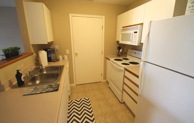 This is a photo of the kitchen in the 1110 square foot Freedom Patio at Washington Place Apartments in Washington Township, OH.