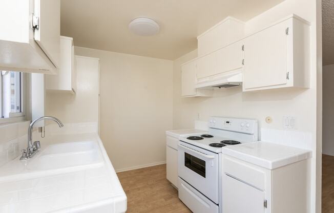 Kitchen with White Appliances and White Cabinets