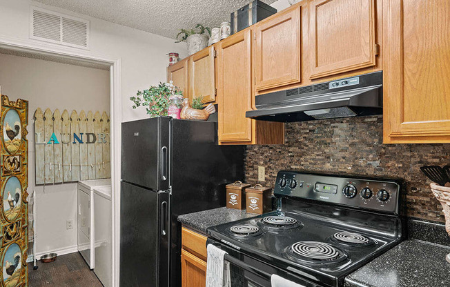 apartment kitchen with a stove and a refrigerator