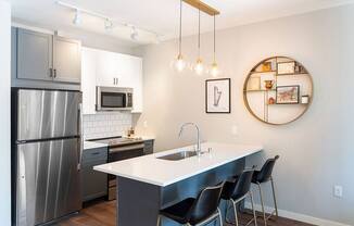 Kitchen with stainless steel appliances and pendant lighting - Harper