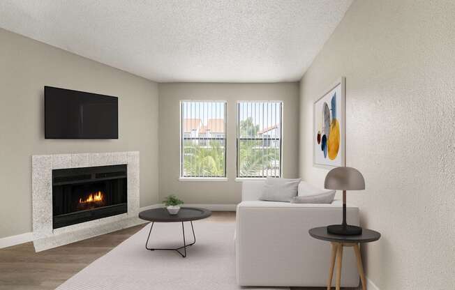 A living room with a fireplace, a couch, a table, and a painting on the wall.